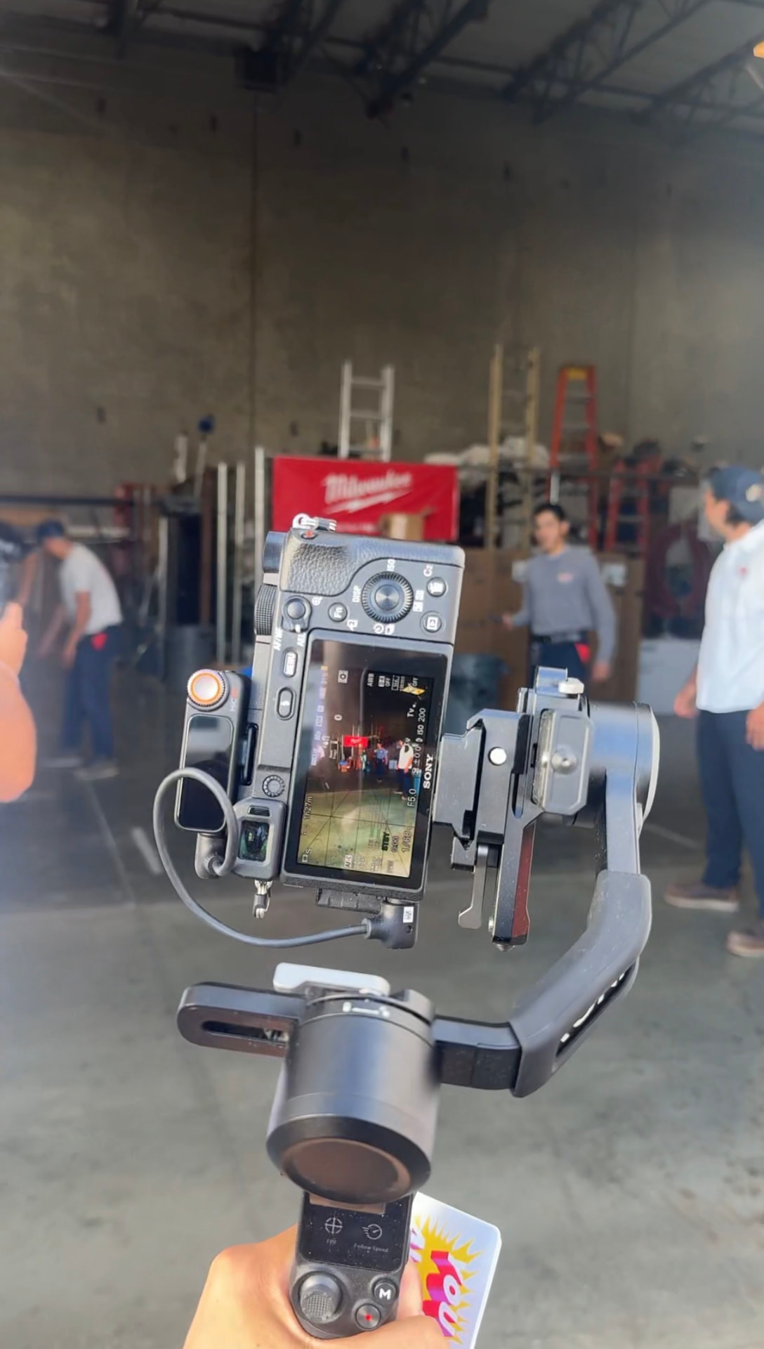 Camera on a gimbal filming a contractor shop walkthrough