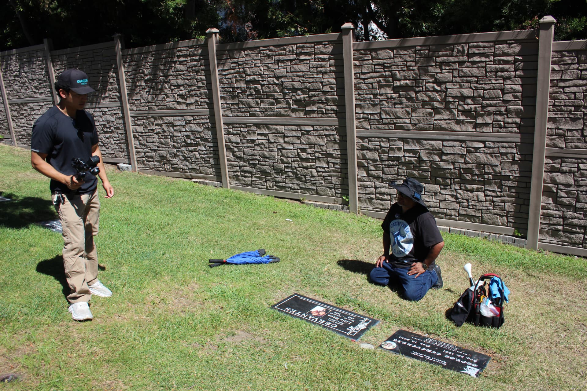 Filming a headstone restoration specialist at work