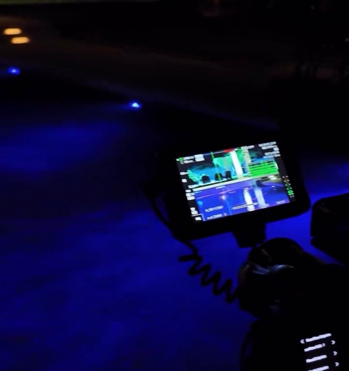 Night shoot with a camera monitor lit in blue